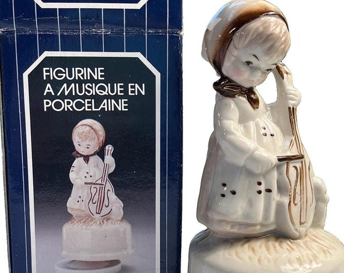 Vintage bisque girl playing cello W/ Bunny music box 1983 tune “feelings” W/BOX