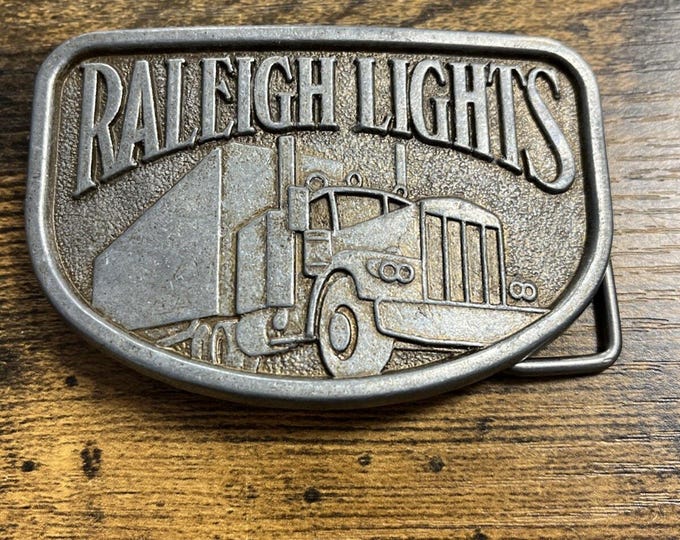 Vintage Raleigh Lights Belt Buckle Big Rig Semi Truck Trucker Apparel