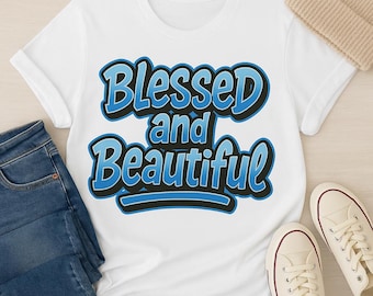 May include: White t-shirt featuring the text "Blessed and Beautiful" in blue and black. The image includes blue jeans, a beige beanie, and white trainers.