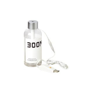 May include: A white and silver USB humidifier with a clear bottle and the text "300M ROUND BOTTLES HUMIDIFIER".