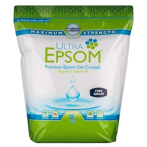 May include: A bag of Ultra Epsom salt crystals. The bag is white with green and blue accents and features the text "Ultra Epsom" in large green letters. The bag contains 18 lb (8 kg) of fine grain Epsom salt, suitable for bath, spa, garden, and health.