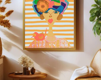 May include: Abstract art print featuring a stylized woman with a colorful floral headdress and a bird perched on top. The artwork has a striped background in orange and white, framed in gold. A second bird is perched on the woman's shoulder.