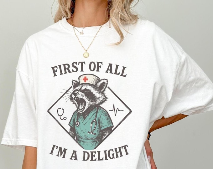 First of All I'm a Delight, Funny Nurse Humor Shirt, RN Sarcastic Shirt, Funny Medical Quote Shirt, Trendy Raccoon Tee, Raccoon Delight