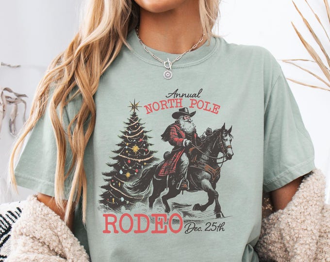 North Pole Rodeo Cowboy Santa Shirt, Horseback Santa Claus Gift, Funny Western Christmas Rodeo Country T Shirt, Retro Santa Rodeo Tee