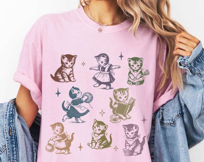 Kitten playing with Yarn Shirt