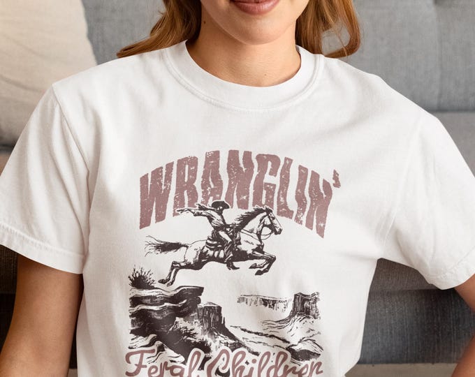 Featured listing image: Vintage 'Wranglin Feral Children' shirt, Comfort Colors Tee, Funny Parent Shirt,  Gift for Parents, Vintage Style Graphic for Mom or Dad