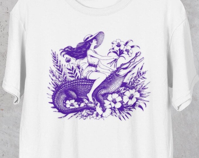 Featured listing image: Retro Florida Women Tee, Women Riding Alligator Tee, Comfort Colors, Funny Animal Lover Shirt, Alligator Gift Top, Swamp Adventure