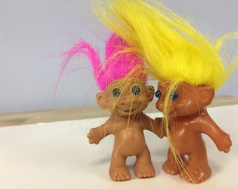 Two Small Treasure Troll Dolls with Pink and Yellow Hair