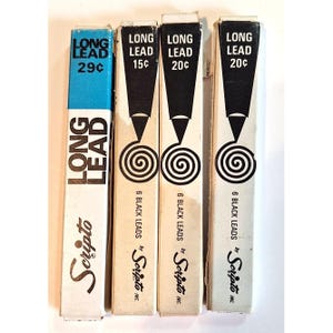 May include: Four rectangular boxes of Scripto Long Lead refills. The first box is blue and white with 29 cents printed on it. The other three boxes are white with black accents, featuring a pencil graphic, a spiral, and prices of 15 cents and 20 cents.