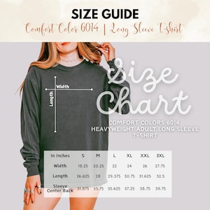 May include: Size guide for a Comfort Colors 6014 heavyweight adult long sleeve t-shirt. The chart shows measurements in inches for width, length, and sleeve center back for sizes S through 3XL. The shirt is a dark gray color.