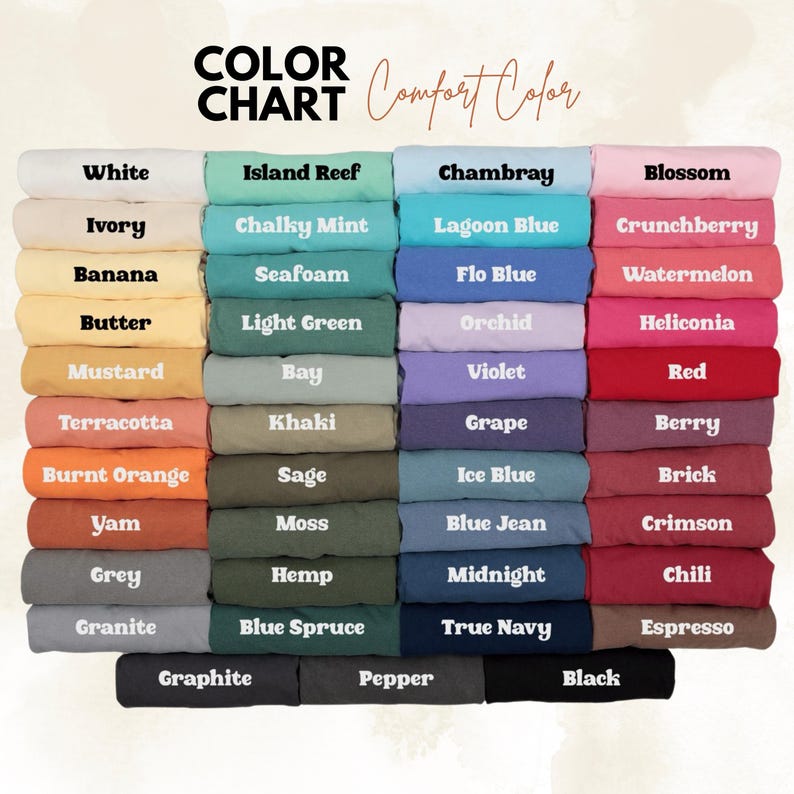 May include: A color chart displaying a variety of fabric colors, including white, blue, pink, and green. The text "COLOR CHART" and "Comfort Color" are at the top. Each color is labeled with its name, such as "White," "Chambray," and "Black."