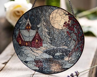 星とクリスマスツリーが描かれた雪のコテージのステンドグラスパネル