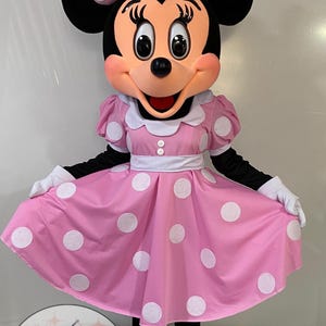 ミニーマウスのピンクのマスコットコスチューム（特別なリボン付き）。商品説明をよくお読みください。