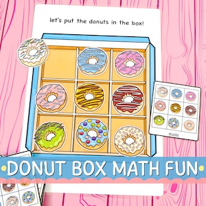 May include: A colorful educational game featuring a box of donuts with various toppings and a matching card. The text "let's put the donuts in the box!" is at the top, and "DONUT BOX MATH FUN" is at the bottom. The donuts have pink, blue, yellow, and green frosting.