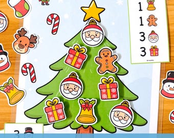 以下が含まれることがあります： 緑のクリスマスツリーと、サンタ、プレゼント、ジンジャーブレッドマンなどのお祝いのステッカーが特徴のクリスマスをテーマにした教育ゲームです。「Let's decorate the Christmas tree!」と「CHRISTMAS TREE MATH」の文字が表示されています。