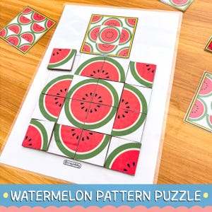 May include: A square educational pattern puzzle featuring watermelon slice graphics on white tiles. The set includes a reference card with a grid of red, green, and black watermelon segments and the brand name crayonbiby printed on the base.