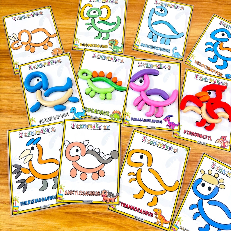 Puede incluir: Un conjunto de tarjetas de manualidades con tem&aacute;tica de dinosaurios. Cada tarjeta presenta un dinosaurio diferente, como un Braquiosaurio o un Velociraptor, con la frase "I can make a" impresa. Los dinosaurios est&aacute;n hechos de arcilla colorida.
