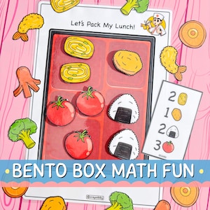 May include: An educational game with a bento box theme. The image shows a bento box with illustrations of food items such as tomatoes, sushi, and shrimp. Text includes "Let's Pack My Lunch!" and "Bento Box Math Fun."