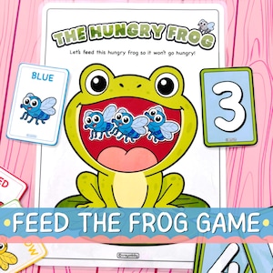 Puede incluir: Una hoja de juego imprimible titulada THE HUNGRY FROG que muestra una rana verde grande con la boca abierta que contiene tres ilustraciones de moscas azules. La hoja incluye el texto Let's feed this hungry frog y FEED THE FROG GAME.