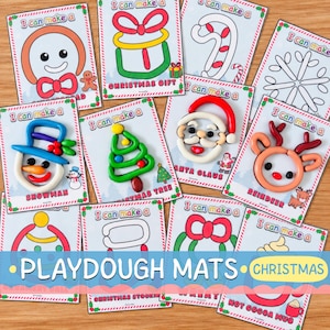 Könnte beinhalten: Eine Sammlung von zwölf rechteckigen Knetunterlagen mit Weihnachtsmotiven, die bunte Illustrationen und Texte wie I can make a Snowman, Christmas Gift, Santa Claus, Reindeer, Christmas Tree und Hot Cocoa Mug für kreatives Spielen zeigen.