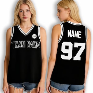 May include: A black sleeveless basketball jersey featuring white trim on the V-neck and armholes. The front displays the text TEAM NAME and a circular logo. The back shows the text NAME above the large white number 97 in a bold block font.
