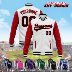 May include: White varsity jacket with red sleeves, black and white striped trim, and the text "Anyname" in black script. The number "00" is displayed in black. The image also shows the text "Custom Any Design".