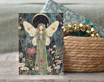 May include: A rectangular greeting card featuring a central illustration of a winged figure with long hair, wearing a long green patterned gown, standing amidst various colorful flowers and foliage against a dark blue background with a golden crescent moon.