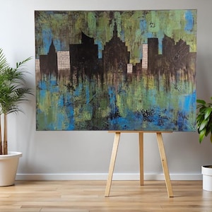 Acrylic on canvas, abstract city silhouette, modern skyline in blue, green, and gold, large-format wall art (120x90 cm)