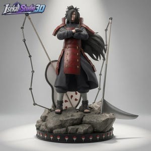 May include: A Madara Uchiha character figurine standing on a rocky base with a circular logo border. The figure wears dark clothing and red armour, with long black hair, arms crossed, a large fan, and a scythe. The Isekai Studio 3D logo is visible.