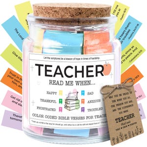 May include: A glass jar with a cork lid filled with colorful Bible verses for teachers. The jar has a label that reads "TEACHER READ ME WHEN..." and includes a tag with a message of appreciation. The jar contains color-coded verses.
