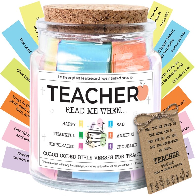 May include: A glass jar with a cork lid filled with colorful Bible verses for teachers. The jar has a label that reads "TEACHER READ ME WHEN..." and includes a tag with a message of appreciation. The jar contains color-coded verses.