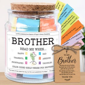 May include: A glass jar with a cork lid, filled with colorful Bible verses. The jar has a label that reads "BROTHER" and "READ ME WHEN..." with various emotions. A tag tied with twine says "TO MY Brother" with a thank you message.