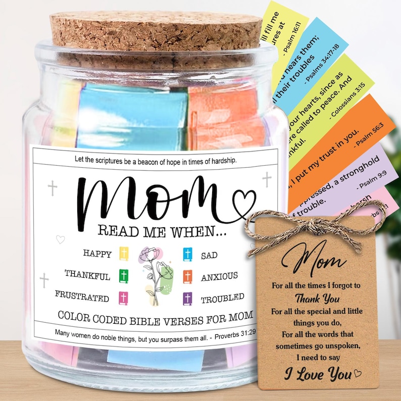 May include: A glass jar with a cork lid, filled with colorful Bible verses. The jar has a label that reads "Mom, Read Me When..." and includes a tag with a message of love. A thoughtful gift.
