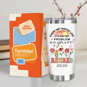 May include: A white stainless steel double-wall tumbler with a floral design and the text "EVERY SIP TASTES LIKE IT'S NOT MY PROBLEM anymore RETIRED 2026". The tumbler is 20 oz (591 ml). The tumbler is next to an orange box.
