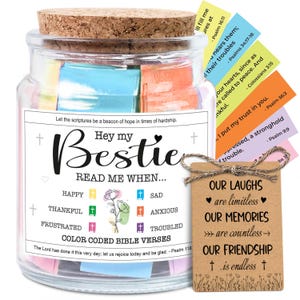May include: A glass jar with a cork lid, filled with colorful Bible verses. The jar has a label that reads "Hey my Bestie, Read Me When..." with various emotional prompts. A small tag with a twine string reads "Our Laughs are limitless, Our Memories are countless, Our Friendship is endless."