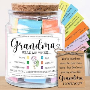May include: A glass jar with a cork lid, filled with colorful Bible verses. The jar is labeled "Grandma" and includes prompts like "Happy" and "Sad." A small tag reads "Grandma, I love you."
