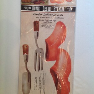 May include: A set of four stencils for creating a garden-themed design. The stencils include two garden clogs, a trowel, and a fork. The stencils are made of a durable material and are easy to use. The stencils are perfect for adding a touch of whimsy to your home decor.