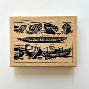 May include: A wood block print with black ink illustrations of different types of boats. The print includes the names of each boat type, such as "Half-decked Boat" and "Skiff".