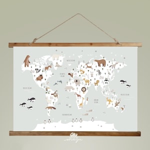 May include: A world map print featuring animal illustrations, including bears, deer, and giraffes. The map is in soft colors and is suspended by a wooden frame and a rope. The oceans are labeled. The text "Design by Maya" is at the bottom.