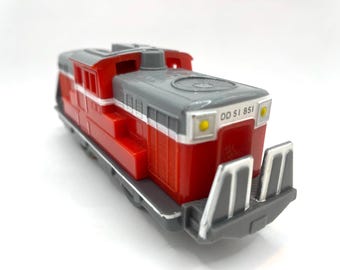 This is the Takara Tomy Plarail KF-03 DD51 diesel locomotive No. 851, released in 2001. A classic Japanese toy train, perfect for collectors