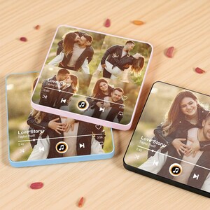 May include: Three square personalized phone cases with a photo collage of a couple. The cases are in pink, blue, and black. Each case displays a music player interface with the text "Love Story Taylor Swift".