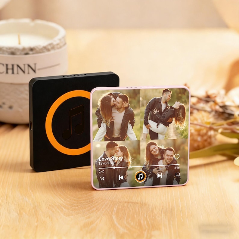 May include: A black and orange music player with a circular design and a music note icon. Next to it is a pink music player displaying a photo collage and a music player interface. The song title is "Love Story".