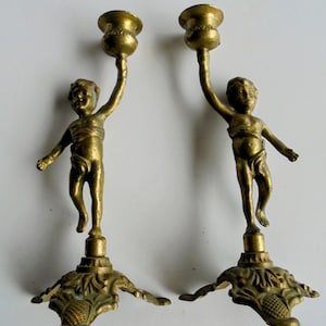 Pair of Bronze or Brass Putti Cherub Candle Stick Holders
