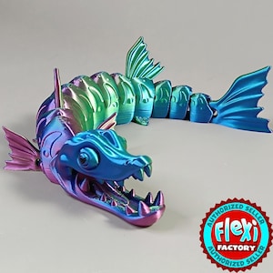 May include: A multi-colored articulated dragon figurine with a metallic finish. The dragon has a detailed head with sharp teeth, fins, and a segmented body. The colors shift from blue to green to purple. The Flexi Factory authorized seller logo is in the bottom right.