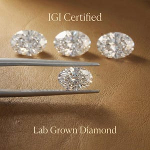 IGI certified lab grown oval diamonds in assorted sizes displayed on leather background, ethical loose diamonds for fine jewelry and engagement rings