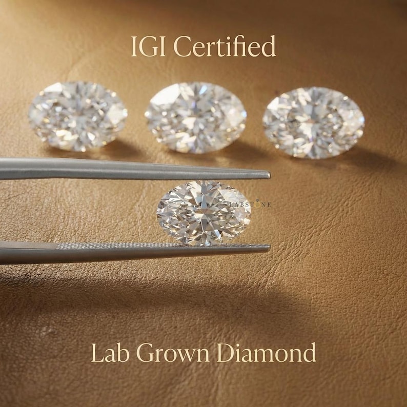 IGI certified lab grown oval diamonds in assorted sizes displayed on leather background, ethical loose diamonds for fine jewelry and engagement rings