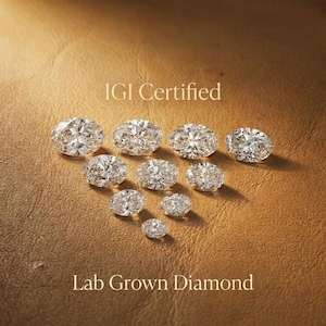 Oval cut lab grown diamond held with tweezers, close up diamond inspection for custom engagement ring, loose oval diamond showcasing brilliance and symmetry for fine jewelry design