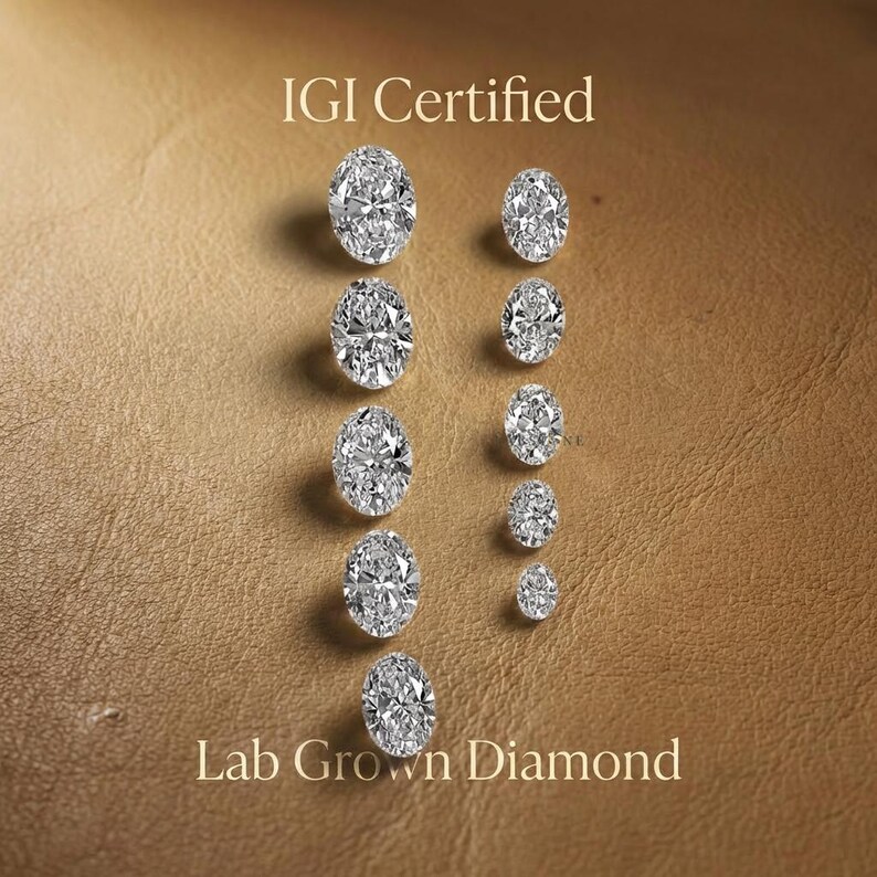 IGI certified oval lab grown diamonds lined in a row, comparison of oval diamond sizes and sparkle for engagement ring selection