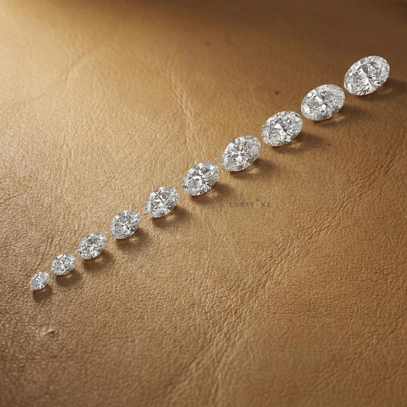 IGI certified oval cut lab grown diamonds displayed in vertical size comparison, loose diamonds for custom engagement rings and bridal jewelry