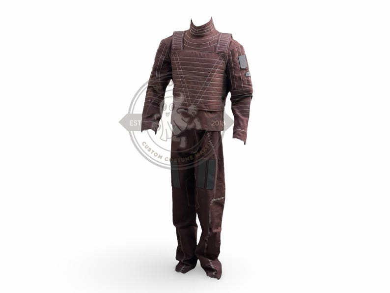 May include: A maroon costume with a high collar, long sleeves, and matching trousers. The outfit features horizontal stitching and black patches on the shoulders and legs. The costume is designed for cosplay or theatrical use.